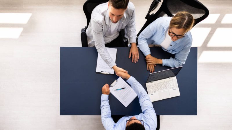 Professional,Consultant,Guide,Couple,In,Meeting,With,Advisor,For,Financial